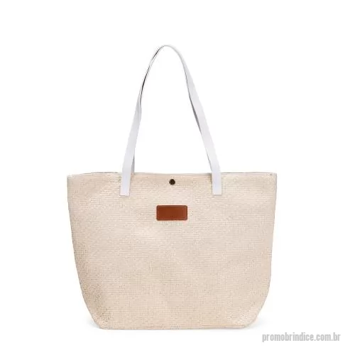 Bolsa multiuso personalizada - Bolsa em palha trançada com fechamento em botão metálico. Revestimento interno em algodão, bolso com zíper, alças e plaqueta em couro sintético.