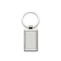 Chaveiro de metal retangular com chapa central, verso liso.  Medidas aproximadas para gravação: (CxL): 3,6 cm x 2,1 cm Tamanho: (CxL): 8 cm x 3,4 cm