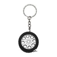 Chaveiro trena 1 metro formato pneu brilhante, material emborrachado com relevo. Detalhes do aro em plástico prata, verso liso. Trena não possui trava.