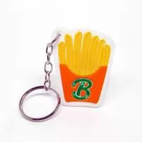 Chaveiro Emborrachado, Gravação em Alto relevo com a logo do cliente. Desenvolvimento de formato específico. Acabamento em cordão de nylon e argola (ou em corrente metálica e argola).