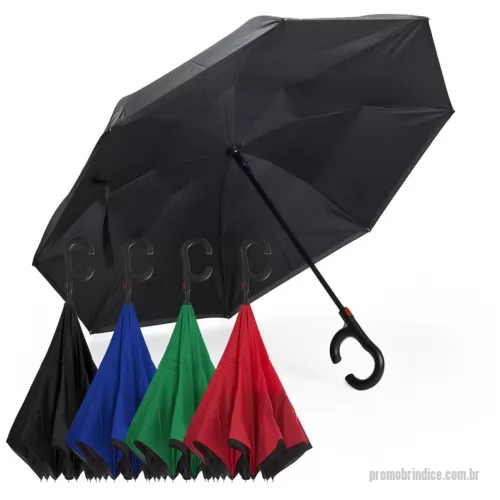 Guarda chuva personalizada - O guarda-chuva possui cabo em plástico no formato C, haste em metal e sistema de abertura automática acionado por botão. A cobertura é confeccionada em tecido ponge chinês, também denominado seda crua poliéster 190T Pongee, e conta com oito varetas de sustentação.  A estrutura é composta por dupla camada com armação oculta, o que evita o contato direto com as hastes. O tecido interno é equipado com sistema de ventilação à prova de vento, que permite a passagem controlada de ar, reduzindo a pressão sobre a cobertura.  O modelo apresenta abertura e fechamento invertidos em relação ao guarda-chuva convencional e possui base que possibilita sustentação vertical, permitindo que se mantenha em pé de forma independente.