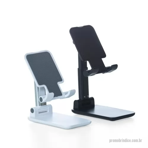 Suporte para celular personalizado - Descrição: Assista seus vídeos, faça chamadas de vídeo e jogue com mais facilidade, a qualquer hora, em qualquer lugar! Produzido em plástico com haste de alumínio, o suporte possui ângulo ajustável e extensão de altura. Seu tapete de silicone antiderrapante garante a estabilidade do eletrônico sem machucar sua traseira. As “canaletas” que também são revestidas de silicone encaixam perfeitamente no eletrônico sem bloquear a visualização da tela, além do espaçamento ideal que permite o carregamento do eletrônico no suporte sem bloquear a visão. Por fim, sua base que também é de silicone antiderrapante, mantém o suporte fixo e estável nas mais variadas superfícies.  Altura :  11 cm  Largura :  6,6 cm  Espessura :  2,8 cm