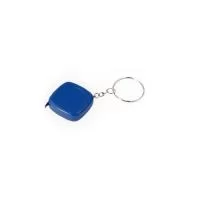 Chaveiro trena em plástico com argola metálica e fita de aço para medição, com alcance de até 1 metro e marcações em pés e polegadas.